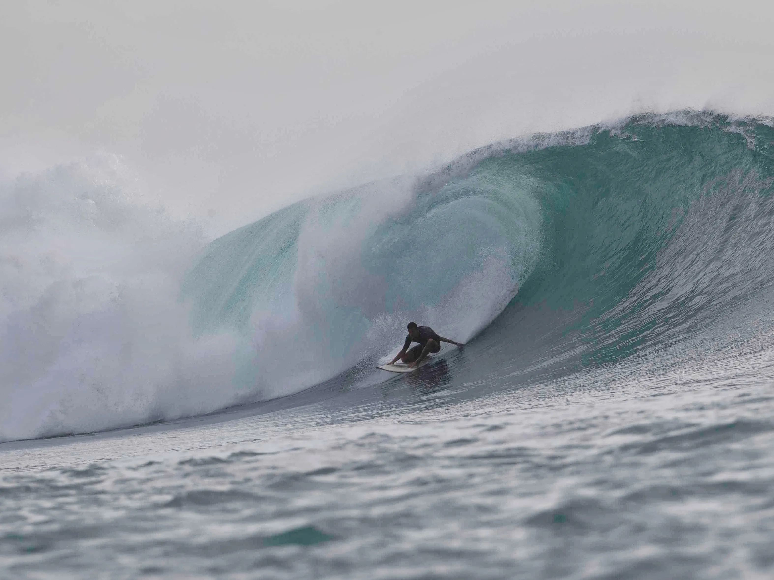 Santiago riding an epic barrel in one of the most iconics waves of Indonesia; 'Desert Point' in the island of Lombok.